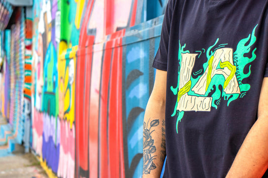 Can screen printing be remove? Custom apparel article. Shows a decorated wall adjacent to a graphic LA t-shirt.